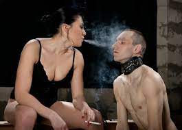 Curvy Russian Mistress Exhales Cigarette Smoke DirectlyInto The Slave's  Face - Femdom Pin