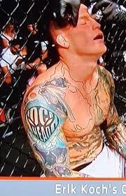 No way does Erik Koch have "KOCH HEAD" tattooed