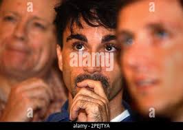 American journalist living in Hong Kong and Kerry supporter, Glenn Berkey  of Pittsburgh, PA., center, flanked by Andy Barker, a teacher from  Hampshire England living in Hong Kong, right, and Eddie Cassidy, a change  management consultant from Glasgow ...