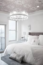 Elegant White And Gray Bedroom Features A Stunning Ring Chandelier Hung From A Ceiling Covered In Pi Pink Bedroom Decor Grey And White Wallpaper Bedroom Design