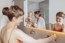 One thing to note here is that moisture can damage your speaker, so make sure the bathroom is well ventilated. Lesbian Couple And Their Little Son Getting Ready For Their Day In The Bathroom Mff04448 Mareen Fischinger Westend61