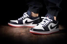 An oversized backward facing swoosh is featured prominently on the lateral side of the shoe, while a regular swoosh graces the medial side. Authentic Bnib Air Jordan 1 Low Obsidian Ember Glow Men S Fashion Footwear Sneakers On Carousell
