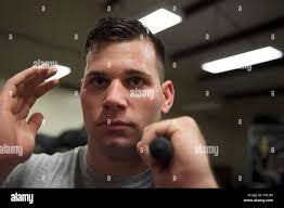 Senior Airman Kyle Creech, a Raven apprentice student, holds a baton during  a three-week Phoenix Raven apprentice course Feb. 17, 2016, at Joint Base  Charleston, S.C. Ravens are teams of specially trained