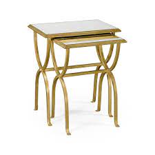 The tables' modern design includes a gold geometric base and hexagonal tabletops, available in a range of contemporary colours. Gold Nest Of Tables With Glass Top Swanky Interiors