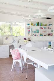All white can get boring, fast, so liven it up with potted plants and greenery. Beautifully Organized Craft Rooms Craft Room Design Craft Room Craft Room Organization
