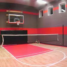 Our home basketball court 45' x 45' with 3 cut outs in the walls to create more room for the 3 hoops. Facilities Sport Court