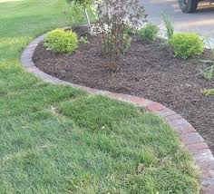 Steel landscape edging keeps a clean line between grass and flower beds. Pin On Home Outside