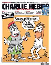 Man shows the french satirical magazine 'charlie hebdo', featuring a caricature of the prophet muhammad on its cover, following a petrol bomb attack. 45 Charlie Hebdo Ideas Charlie Hebdo Charlie Je Suis Charlie