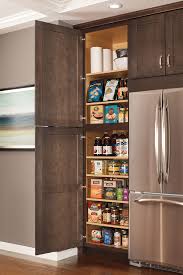 Separate your cabinets to have your daily items within arm's reach, your weekly ones a little higher up, and the rest on your top shelves. Cabinet Organization Products Aristokraft Cabinetry