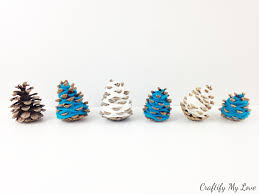 I purchased the vine wire in the floral department at hobby lobby and cut if you don't have the harder type, i have seen them in fall potpourri mixes. i then glued the wire into each pine cone with a dollop of hot glue. Diy Hygge Mini Christmas Trees Craftify My Love