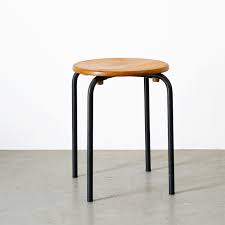 It is finished in a neutral black color. Industrial Stool With Wooden Seat Black Metal Frame 95154