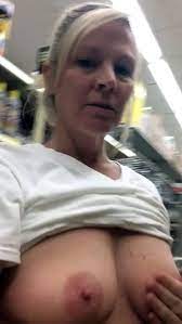 Blonde mature flashing tits and pussy in...