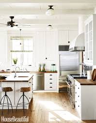 The All White Timber Shell That Is Complemented With A Hint Of Timber And A Touch Of Bla Farmhouse Kitchen Design Wood Countertops Kitchen Kitchen Inspirations