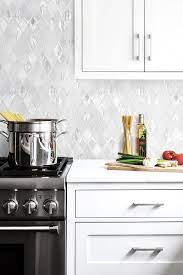 If you already have a granite countertop, you may be wondering what backsplash tile looks best? White Backsplash Tile White Quartz Countertop And Cabinet Backsplash Cabinet Countertop Quartz Tile White