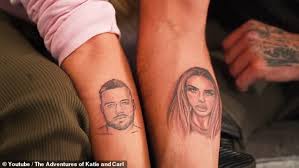 Sounding like the english word tattoo, it is also a shortened version of the russian phrase та любит ту (ta lyubit tu), meaning this girl loves that girl.14 for the release of their first. Katie Price And Boyfriend Carl Woods Get Face Tattoos On Arms Fr24 News English