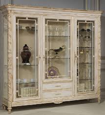 A short curio cabinet display case looks great in any room with a wall mirror above it. Casa Padrino Luxury Baroque Display Cabinet White Gold Noble Solid Wood Showcase With 3 Glass Doors And 2 Drawers Hotel Furniture Castle Furniture Luxury Quality
