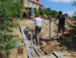 Pose De Vis De Fondation Krinner Pour Accueillir La Structure D Une Charpente En Bois Une Realisation De Cote Terrasse Ground Anchor Grounds Railroad Tracks