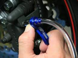 You may need to jack up the car for access to the bleeder screws. How To Change Motorcycle Brake Fluid