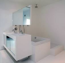 A small modern bathroom outfitted with white subway tile and gray penny tile could look pretty plain, but an interesting country sink and round galvanized mirror add an unexpected touch. Clever Compact Bathroom Design By 123dv