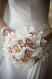 White Cymbidium Orchid Bridal Bouquet By Botanica Orchid Bridal Bouquets Orchid Wedding Orchids Wedding Flowers
