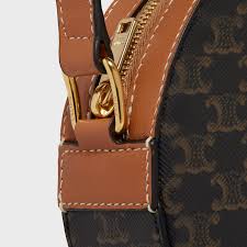 Louis vuitton new monogram round sphere toupie top handle satchel shoulder bag in box monogram canvas brass hardware woven lining zip around closure made in france shoulder strap drop 16 measures 8.5 w x 8.5 h x 4 d includes padlock, keys, dust bag and box 100% authenticity guaranteed newfound luxury is the premier luxury fashion dealer on the 1stdibs platform. Round Purse On Strap In Triomphe Canvas With Embroidered Celine Black Tan 10g342dgz 04bt Celine