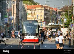 Prague, Czech Republic - July 2018: People catching a tram on a street near  the centre of Prague Stock Photo - Alamy
