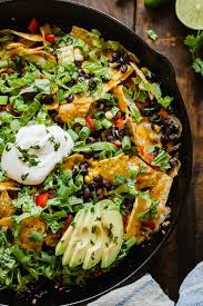 Vegetarian camping recipes that are vegetarian in their essence but can easily be adjusted to other people's preferences as well. Campfire Nachos A Vegetarian Camping Meal That Can Also Be Made At Home Camping Vegetarian Vegetarian Camping Recipes Vegetarian Camping Vegetarian Snacks