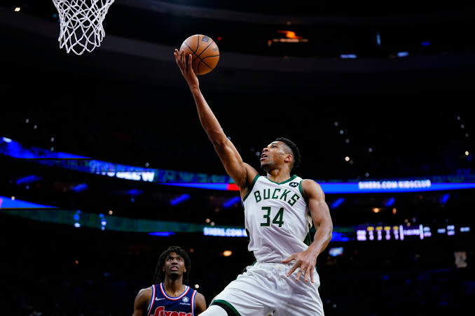 Giannis Antetokounmpo attacking the rim, AI generated