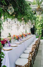 Vibrant Bali Wedding With A Hanging Botanical Installation Ruffled Modern Wedding Reception Greenery Wedding Decor Wedding Shower Brunch Decorations