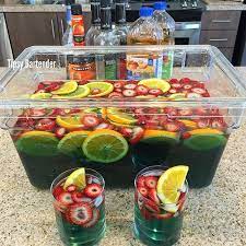Best Super Bowl Jungle Juice For More Delicious Recipes And Drinks Visit Us Here Www Tipsybartender Com Yummy Drinks Jungle Juice Jungle Juice Recipe