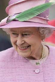 Queen Elizabeth In Light Pink Hat With Feather Green Leaf C Reuters Pool Sang Tang Queen Elizabeth Queen Hat Queen Elizabeth Ii