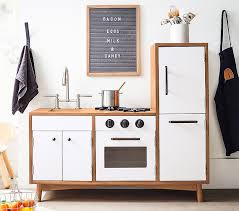 A play kitchen hack that will have you reconsidering your kitchen design. West Elm X Pbk My First Mid Century Modern Play Kitchen Pottery Barn Kids