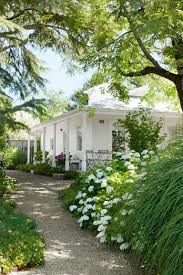 A simple frontal pathway with lush green lawn from both side and a touch of flower bed give a perfect landscaping recipe for the front of your home. 20 Plain Front Yard Landscaping Ideas For Your Garden Space