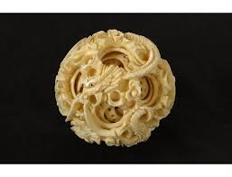 Chinese display carved ivory dragon puzzle ball. Canton Ball Carved Ivory Dragon Star Foliage China Nineteenth Century