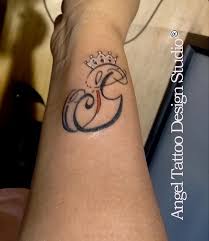 See more ideas about tattoos, body art tattoos, tattoo designs. Letter Gs Tattoo With Crown On Wrist Angel Tattoo Design Studio Gurgaon Queen Tattoo Tattoo Lettering Tattoo Prices