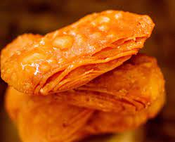 Khaja Recipe Layered Fritters Dunked In Sugar Syrup Recipe Sweet Dishes Recipes Recipes Fritters