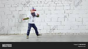 Child Model Posing Image Photo Free Trial Bigstock Portrait of cute little kid boy in stylish jeans clothes looking at camera against white studio wall.
