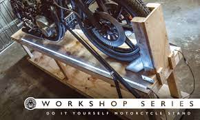 Homemade motorcycle lift constructed from wood. Workshop Series Diy Motorcycle Stand Return Of The Cafe Racers
