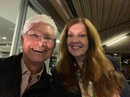 A picture of Sherrone Moore and his assistant during happier times.