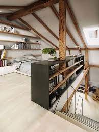 Exemple D Amenagement Des Combles En Espace De Vie Moderne Une Chambre Sous Comble Avec Etageres Mural Attic Bedroom Designs Bedroom Decor Design House Design