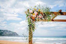 See 50+ beach wedding flowers for your bouquet, centerpieces, arch, boutonnieres & even your cake! Boho Beach Wedding By Wild Blossom Flowers Bridestory Com