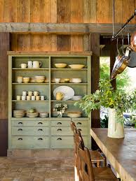 Chic dining room features a classic ring chandelier hangs over a black barley twist dining table lined with linen slipcovered dining chairs atop a trellis rug, the back of the dining room is fitted with a. 30 Delightful Dining Room Hutches And China Cabinets