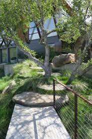 Detail of the concrete pathway with polished mexican pebbles, steel edging and modern light fixtures. 10 Ideas To Steal From Midcentury Modern Gardens Gardenista