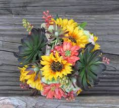 The sunflower has short double yellow petals and the dark middle. Sunflower Succulents Fall Wedding Bouquet With By Justanns 100 00 Wedding Sunflower Wedding Arrangements Sunflower Bouquets Fall Wedding Bouquets