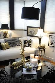 Black And White Living Room Set The Simple Gold Accents In This Room Creates A Decadent Gatsby Feel Luxe Industrial In 2020 Gold Living Room Decor White Living Room Decor Gold Living Room