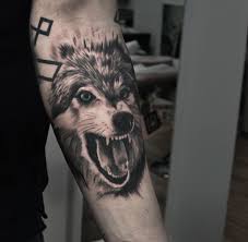 Freshly Done Black And Gray Wolf With Blue Eyes On Mans Hand Artist John Logan Wolf Wolftattoo Anima Wolf With Blue Eyes Wolf Eyes Black And Grey Tattoos