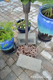 With umbrella stands costing upwards of $150, i decided to try to make my own. Diy Planter Umbrella Stand Tutorial H2obungalow
