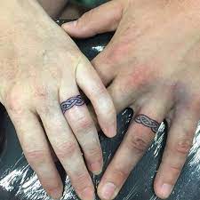 78 Wedding Ring Tattoos Done To Symbolize Your Love Tattoo Wedding Rings Wedding Band Tattoo Ring Finger Tattoos