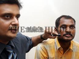 Dr. Milind Naik (left) showing the broken lever of the scooter that  pierced...
