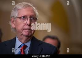 United States Senate Minority Leader Mitch McConnell (Republican of  Kentucky) walks from the Senator Floor to his office before meeting with  newly elected Senators,